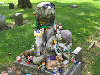 A child`s grave where kids perpetually leave little trinkets.