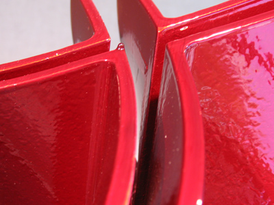 `Red Cross`, a painted steel sculpture by Bret Price.