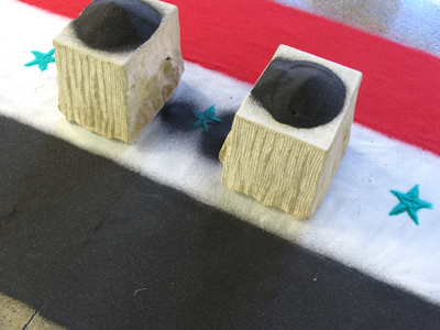 A sand memorial for Dia de los Muertos, or Day of the Dead, commemorating those killed in war.