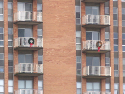 He`ll never be able to land eight reindeer on those balconies.