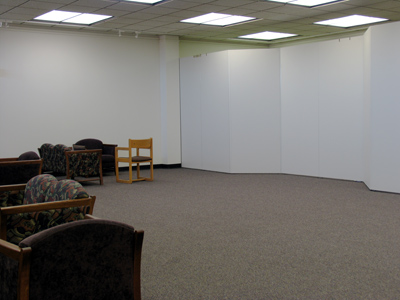 In just a few weeks, these bare gallery walls will display my photographs.