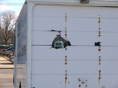 The truck driver got tired of not being able to see out the back.