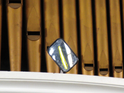 Organists in mirror are closer than they appear.