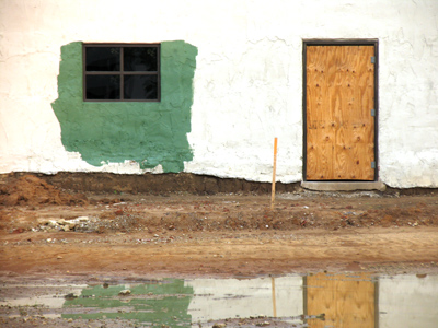 Well, yeah, it looks a bit shoddy now, but wait until we hang the shutters. [This is the same wall from June 20, 2004]