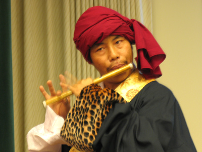 Portraying a herdsman in a traditional Yak Dance.