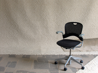 The radio host is getting his makeup done before going on the air.