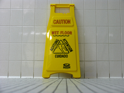 Caution!  Plastic sign left in middle of stairwell.