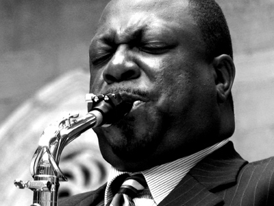 After the first song, the saxophonist/band leader gestured for me to come up and speak to him . . . 