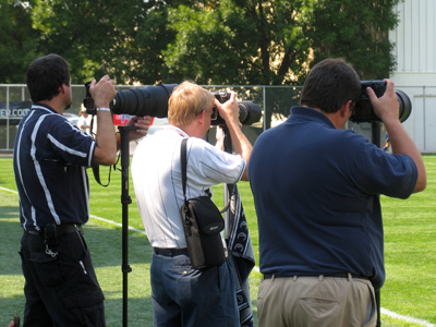 My companions on the sidelines, with their lenses that cost many times as much as my camera.