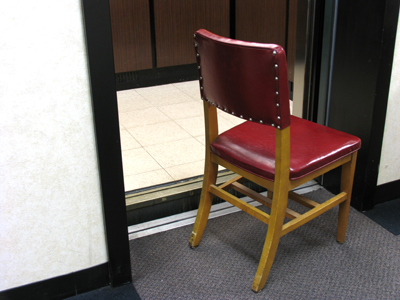 Maybe a safety precaution, maybe a suggestion to sit and wait while the elevator is repaired.