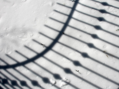 Listen up, children:  this shadow is curved because the sun is ROUND.