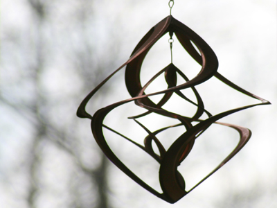 Hanging on someone`s front porch.