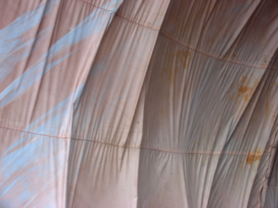 Very large tarp under the highway.