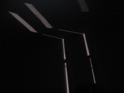 My neighbor`s porch light, as seen on my wall and ceiling.