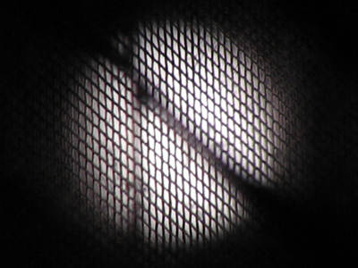 A waxing moon, strained through my window screen and blinds.
