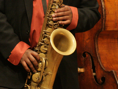 Eddy plays sax, Eddie plays bass.