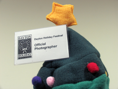 I`ll be glad to wear the Official Photographer badge at the Holiday Festival, but I`ll probably forget to bring the hat.