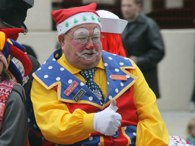 An otherwise normal citizen, until he straps on the giant shoes.