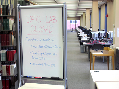 People walk past two large signs saying the lab is closed, then ask me `How come this computer doesn`t work?`