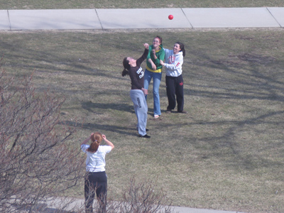 One girl tossed something over her head, the other three fought to catch it -- probably practicing for a wedding.