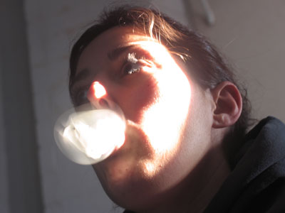 Katie blows bubbles during class.