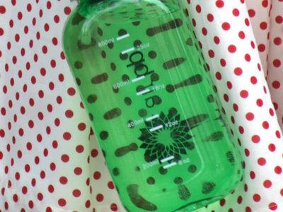 Polka-dot skirt, green plastic bottle.