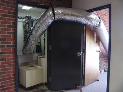 Extraordinary measures are taken to cool the library`s computer network, while the human beings sweat.