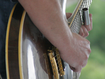 In the old days, they used the neck of a broken bottle.