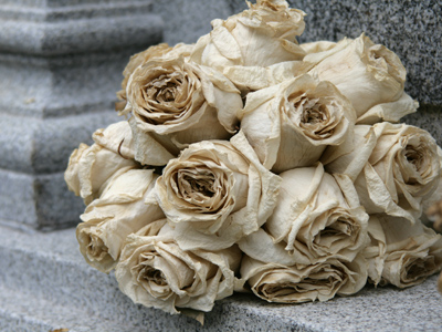 Some bridesmaid evidently left this as an offering at the foot of the statue seen on June 1, 2004.