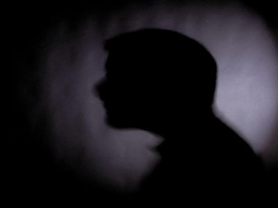 Assignment 2:  circle of light on a dark background with a silhouette inside it.