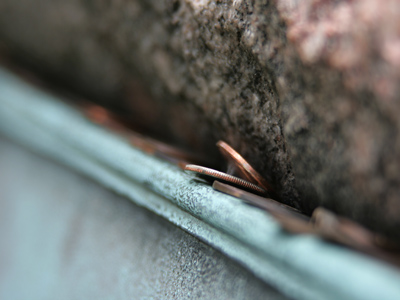 Coins along the top of Paul Laurence Dunbar`s grave.