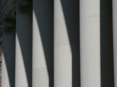 Why do straight columns produce diagonal shadows?