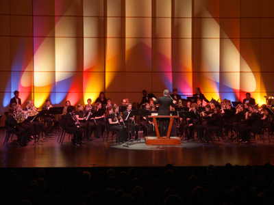 I usually sit in the very front so I can take pictures.  Or I sit in the very back so I can take pictures.