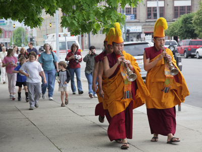 Carrying the sand in a glass jar, the monks then led a noisy procession through downtown Dayton to the muddy banks of the Great Miami River.