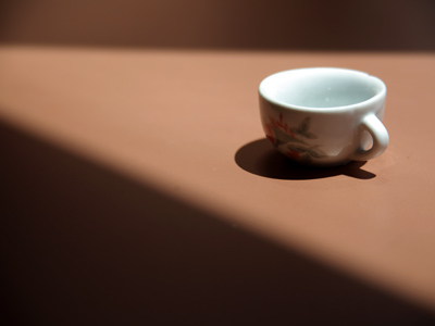 Tiny teacup just as I found it in a windowsill.