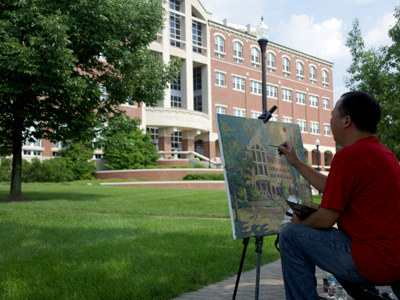 I walked slowly past so I might appear in his painting.