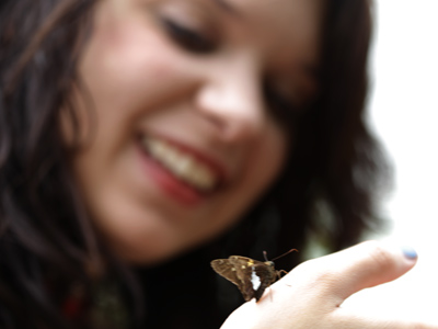 Mary makes a new friend at the Butterfly House.