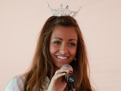 The beauty pageant at the county fair has a lot in common with the livestock competitions going on in nearby barns.