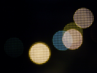 As long as I was looking out the window, I took a picture of the nearby streetlights -- slightly out of focus.