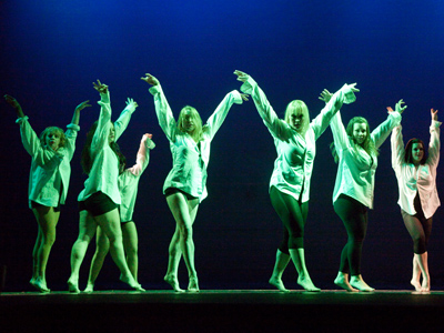 I`ll never understand why, after all the effort of choreographing and teaching a dance routine, a director will then choose to have it performed in near darkness.