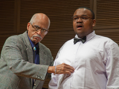 Veteran opera singer helps freshman music major find out where his solar plexus is.