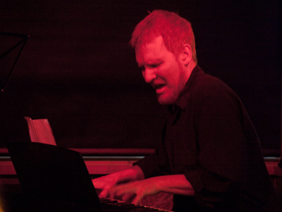 Everyone looks a bit like Mephistopheles because of the red stage lighting.