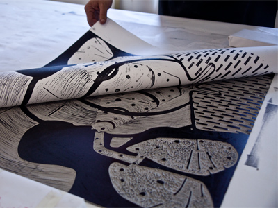 Printmaking with Ryan McCullouh, Step Five:  Remove the paper to reveal the positive image.