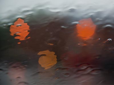 Sitting inside the car in the parking lot, hoping it will stop raining so I can walk to my building, but knowing it won`t.