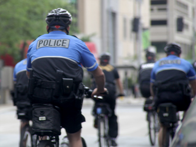 What a great job:  they get to ride bikes and carry guns.
