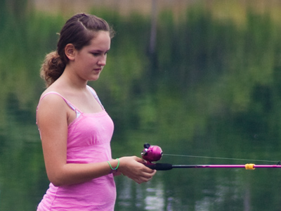 As long as the rod and reel are pink, she`ll go fishing.