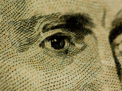 The best deterrent to counterfeiting is simply the secret blend of the paper.  Can you see the tiny colored fibers?