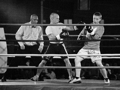 Tonight a free boxing exhibition took place in the middle of an intersection downtown, allowing me to photograph my first fight without compromising my integrity too badly.