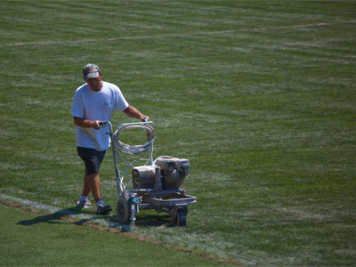 With four hours to go until a game, it`s time to put lines on the soccer field.