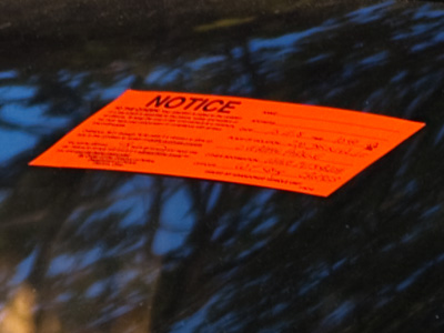 A dead car has been parked by my house for months.  After two calls to the city, this sticker appeared on its windshield today.  The car was gone by the next morning.
